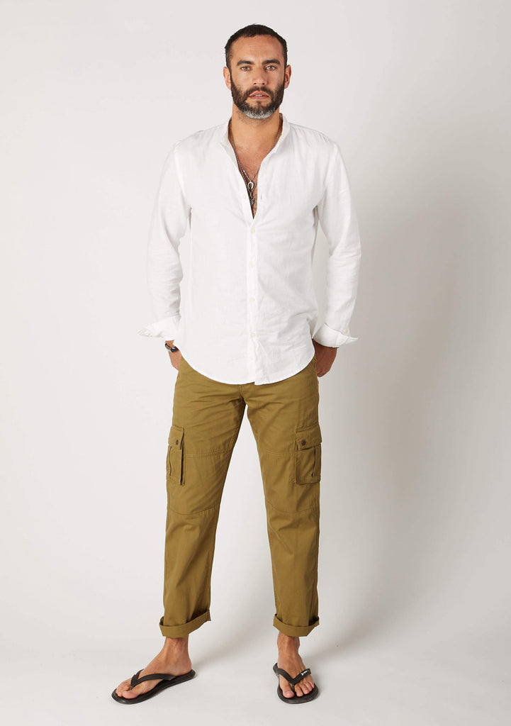 Front pose wearing 'Firswood' brand olive green, 100% cotton combats with arms behind back.
