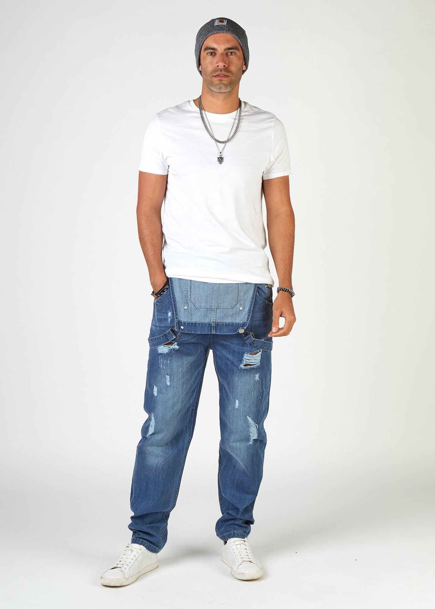 Full-length front view men's dungarees, with bib down, revealing white t-shirt. Wearing 'Bertie' brand relaxed fit ripped dungarees from Dungarees Online.