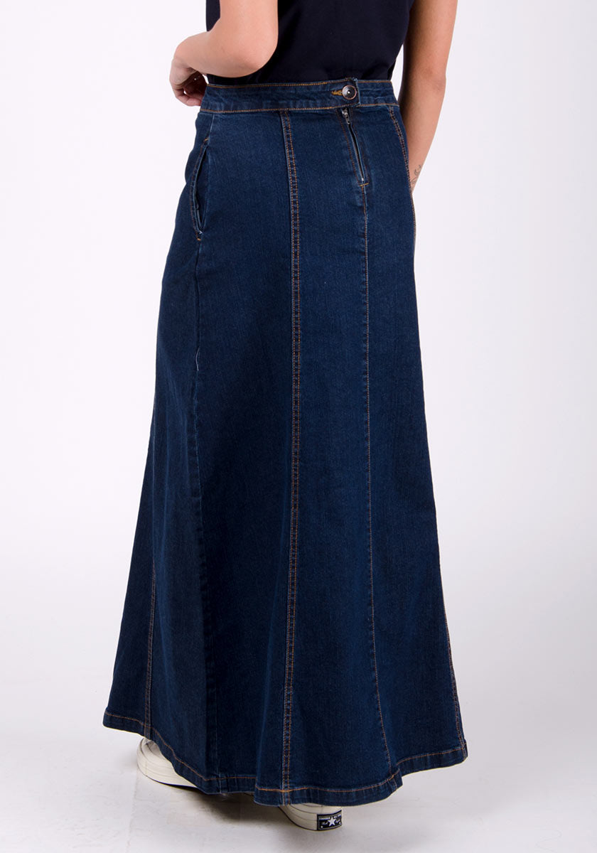 Back close-up view of panelled dark blue denim maxi skirt showing back zip and button fastening.