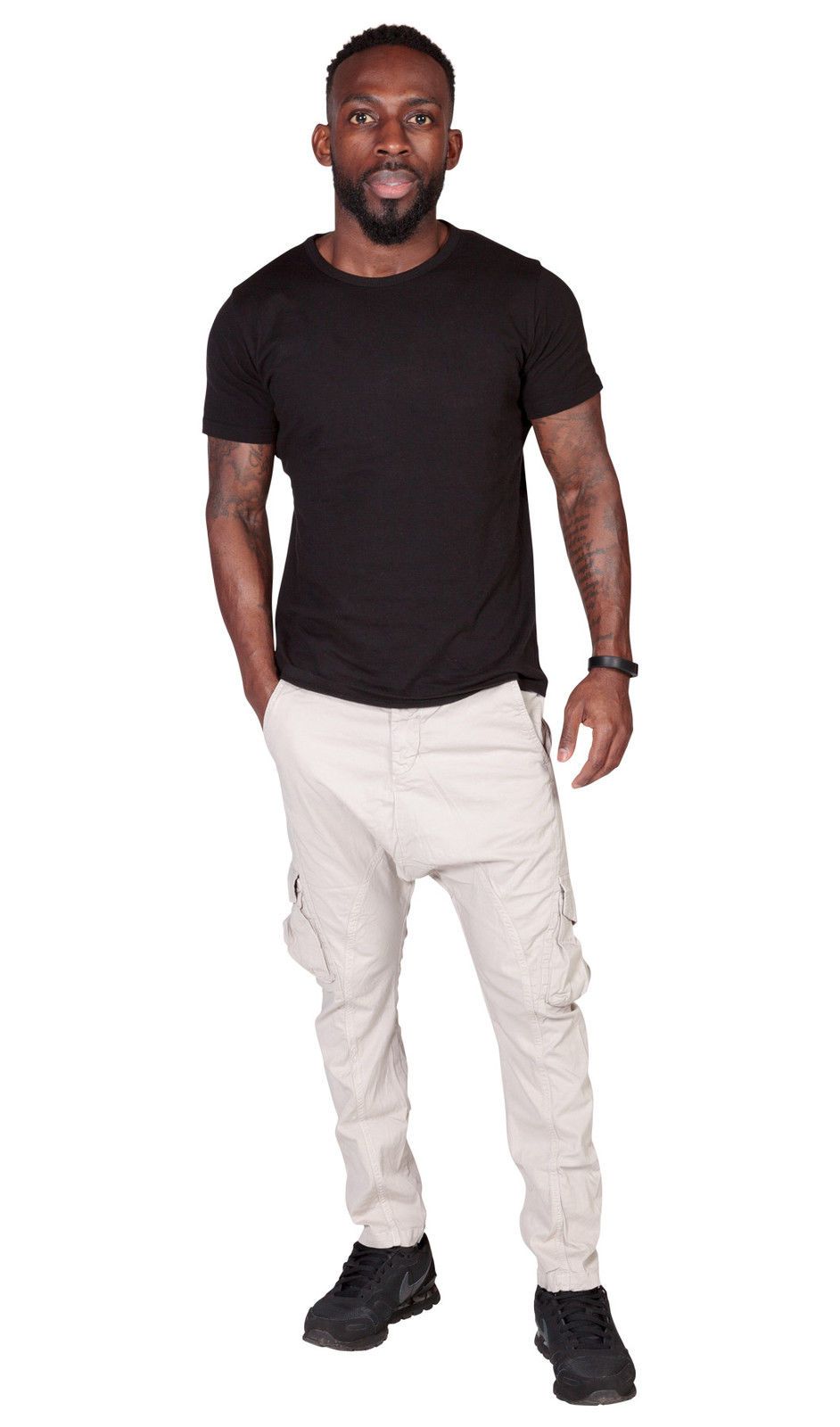 Full frontal view of ‘Finley’ style, casual, slight-stretch cotton cargo trousers in off-white with right hand in front pocket.