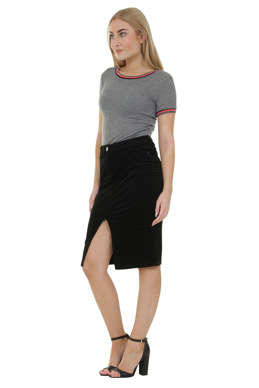 Full-length, angled front pose wearing black cord midi skirt with front split from Dungarees Online.