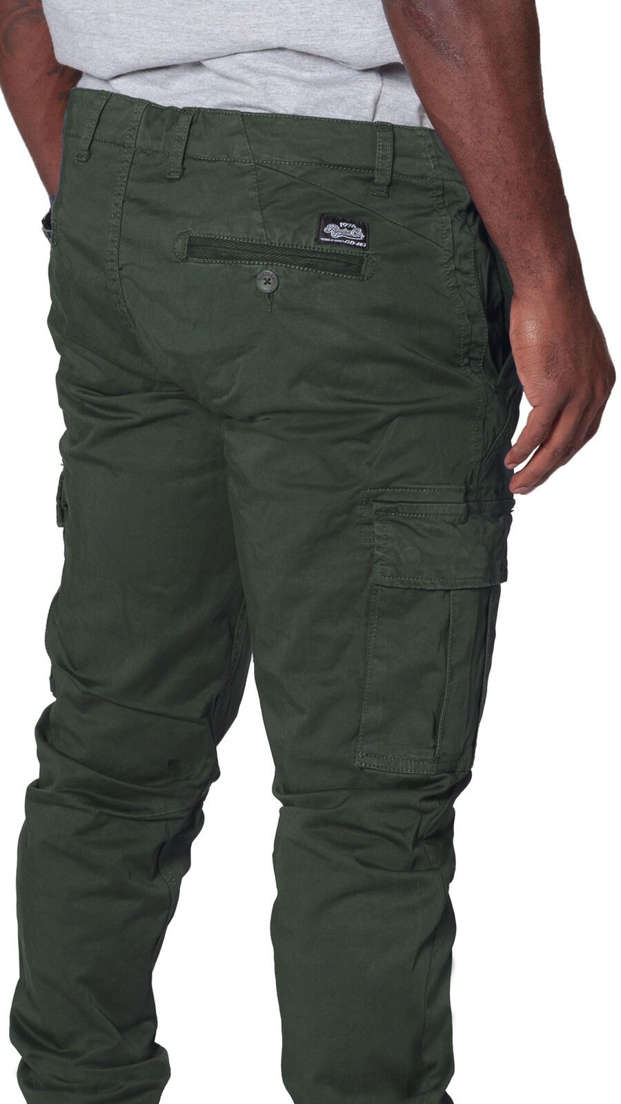 Angled rear focus of cargo trousers, with clear view of stitching, rear and cargo pockets and slightly stretchy khaki-green material.