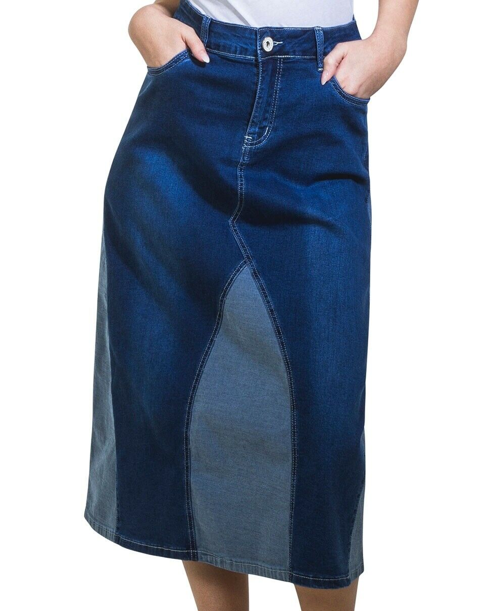 Close-up front shot of model wearing 2-colour denim panelled midi skirt with hands in front pockets and view of front zip and button fastening.