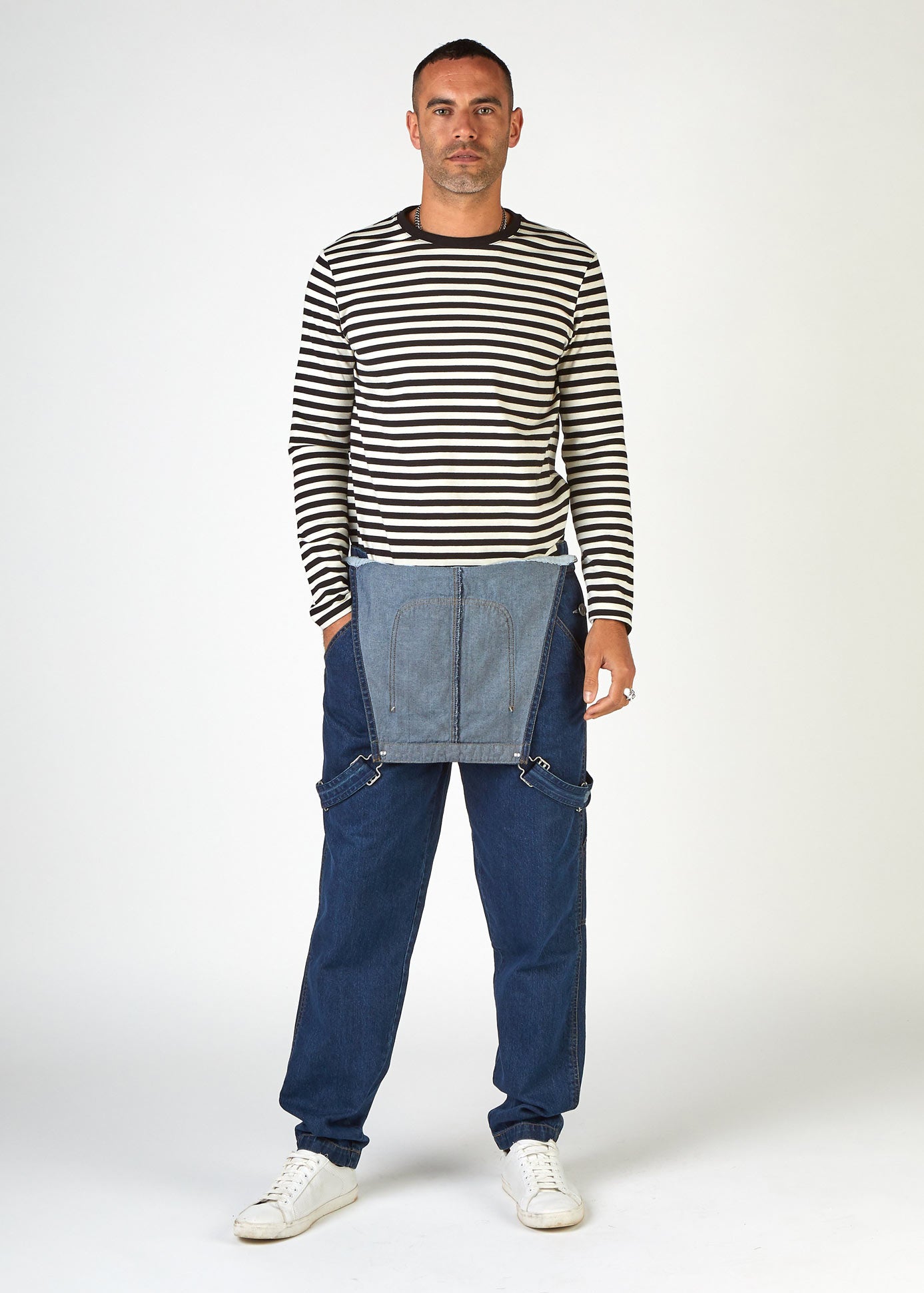 Full-length front bib-down view of loose-fit, indigo bib-overalls from Dungarees Online, revealing Breton-style top.