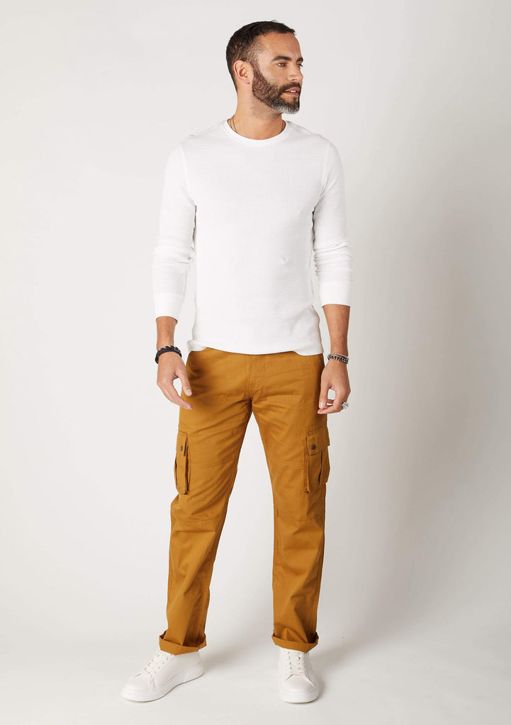 Front view of men's gold-brown organic cotton loose fit cargo trousers.