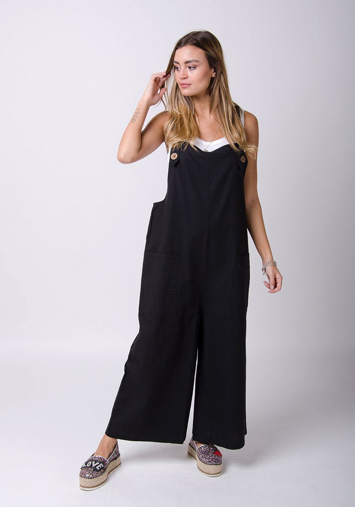 Full front pose wearing WASH Clothing Company's black linen dungarees.