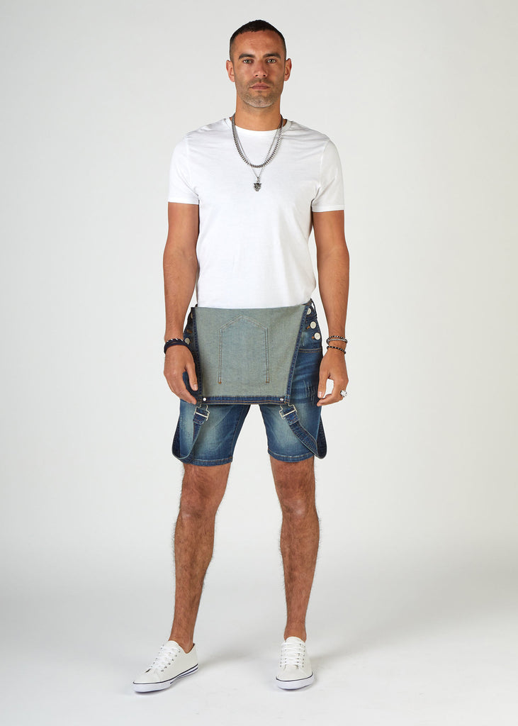 Full-length front bib-down view of 'Whitefield' bib-overall super skinny denim dungaree shorts.