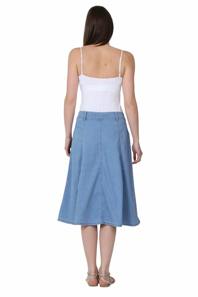 Full-length rear view of stylish, calf-length, light wash denim skirt.