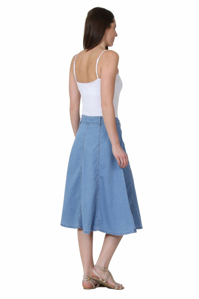 Full side view, facing right, wearing midi light-wash denim skirt.