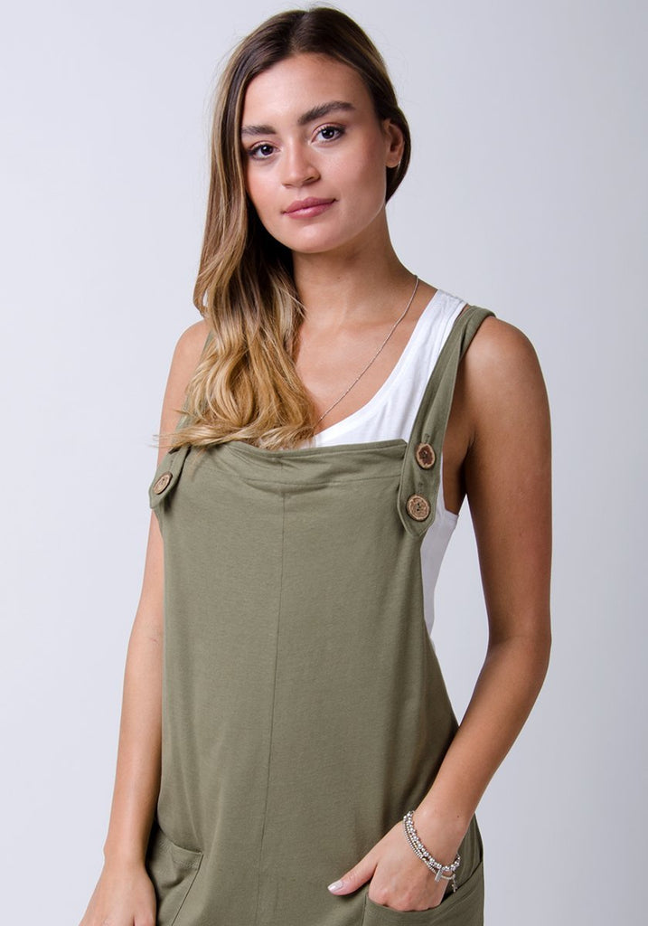 Front half-length pose wearing WASH brand, khaki-green-grey, cotton jersey dungarees.