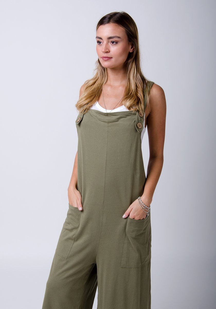 Front two-thirds pose wearing WASH brand, khaki-green, cotton jersey overall and highlighting pockets.
