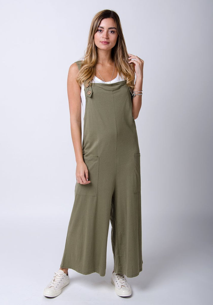 Amber-style, khaki-green cotton jersey, wide-leg overall. Front, full-length pose highlighting functional pockets.