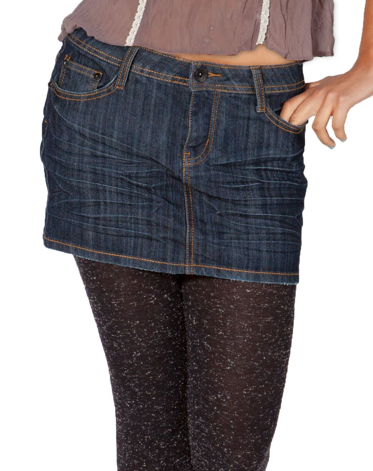 Focus on midriff, highlighting indigo mini skirt with creasing effect from Dungarees Online.