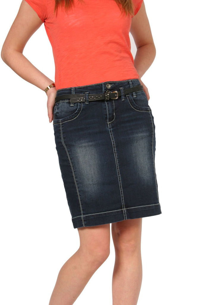 Mid-view, leaning on left hip wearing stylish cotton-mix denim, stretchy skirt from Dungarees Online with belt.
