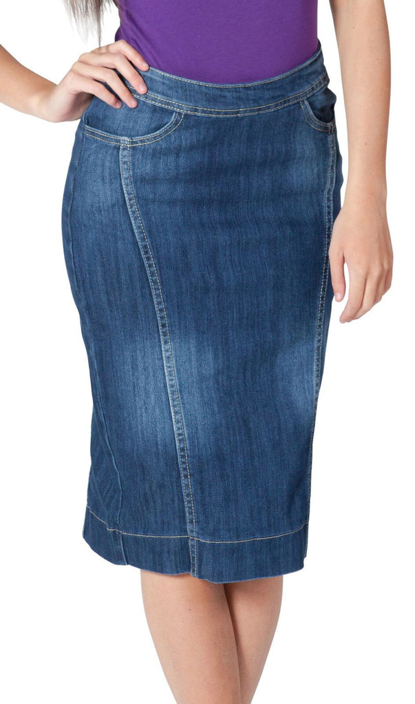 Wearing stylish blue denim skirt from Dungarees Online with view of front pockets and pencil skirt silhouette.