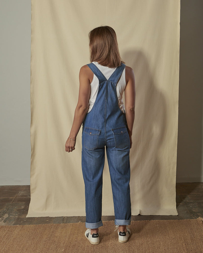 Full-length back shot of Dottie light wash ladies regular fit dungarees.