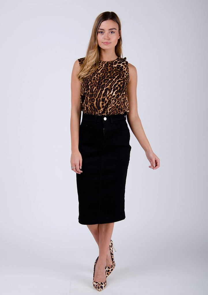 Full frontal pose wearing Cynthia style, black midi-skirt and animal print top.