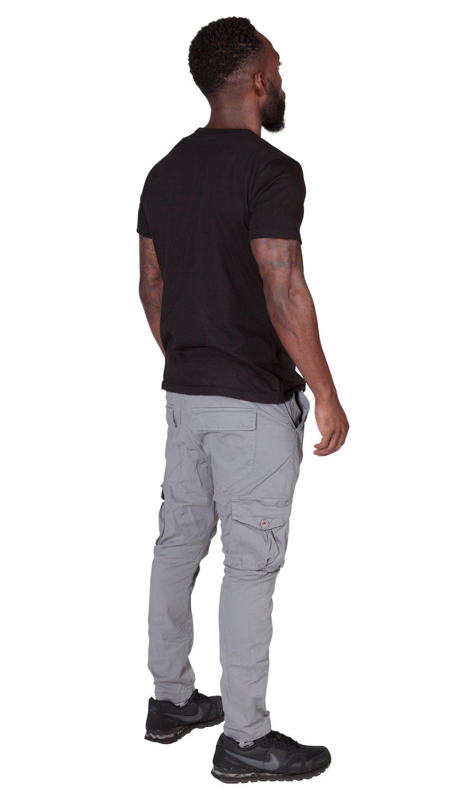Angled back view of ‘Finley’ style, casual cotton mix cargo trousers from Dungarees Online, with view of multiple pockets and tapered silhouette.
