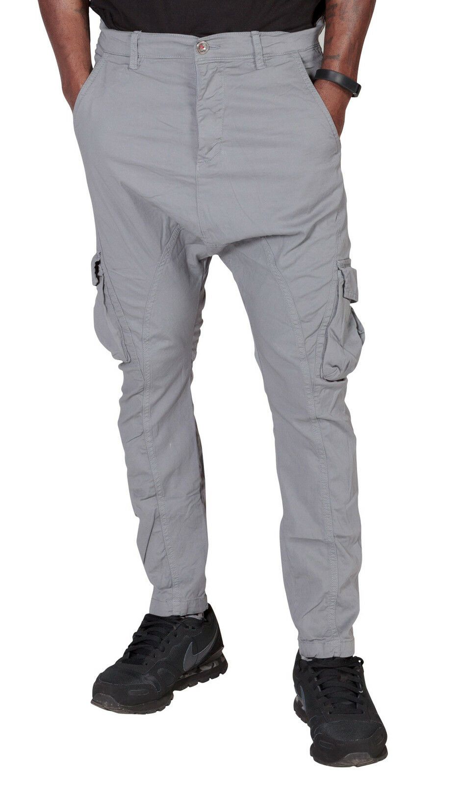 Close-up frontal of ‘Finley’ style, casual cotton mix cargo trousers in grey, with view of front pockets, belt loops and drop crotch styling.