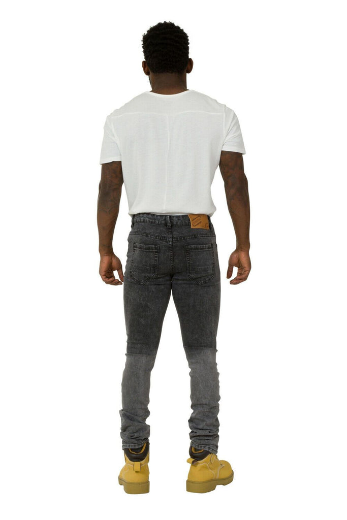 Full back view of slim-fit, faded black denim jeans with back pockets and belt loops.