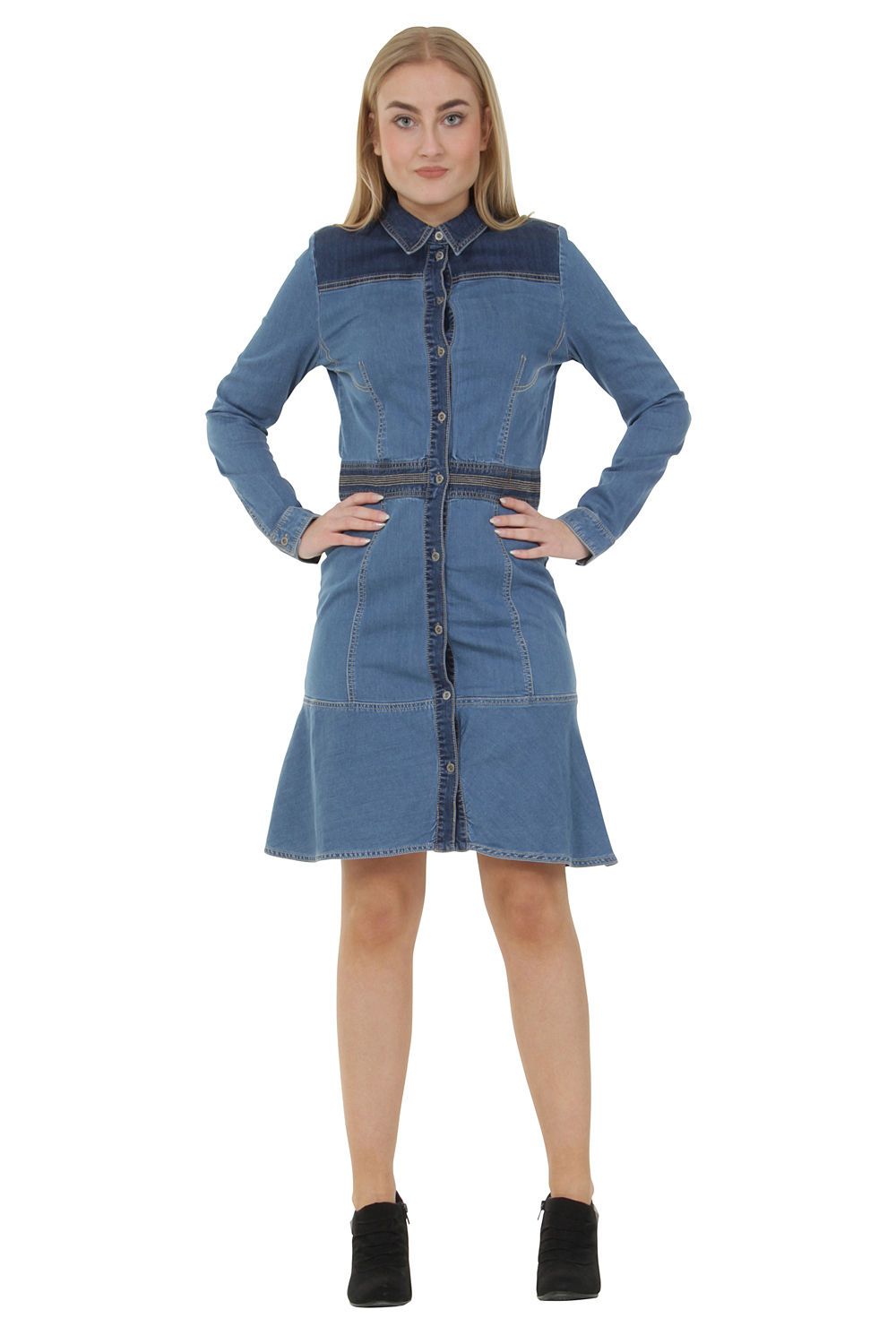 Full frontal view with hands on hips of slightly stretchy, button down denim dress with dark wash denim detailing.