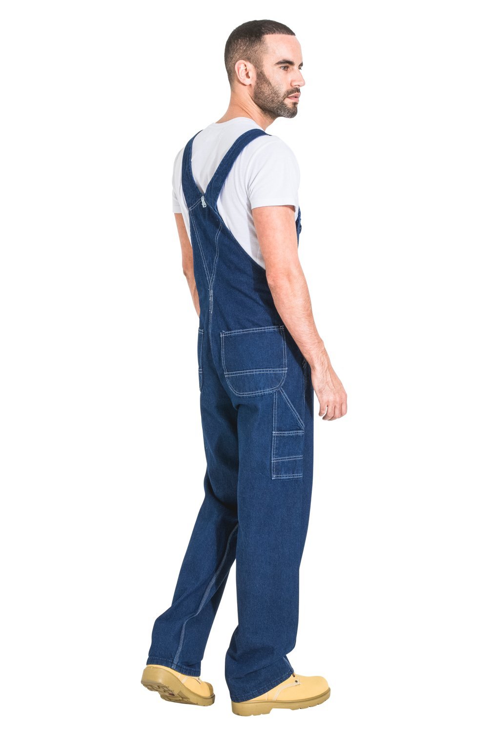 Full-length side view wearing premium work bib-overall showing back cross straps, rear and thigh pockets.