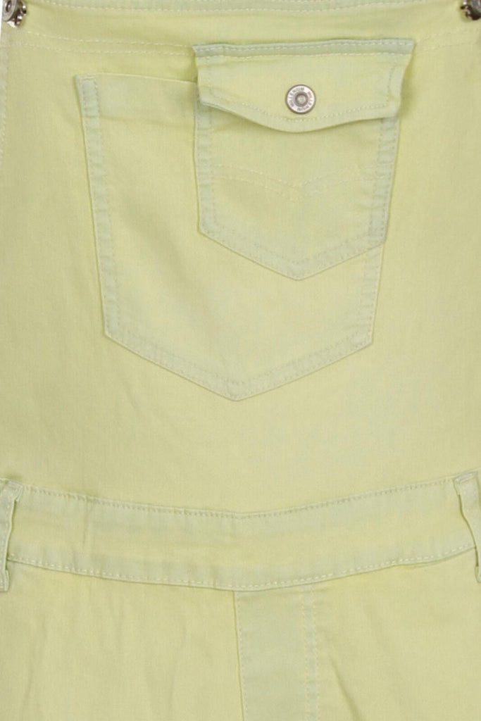 Close-up view of the bib pockets on the pale yellow skinny womens dungarees.