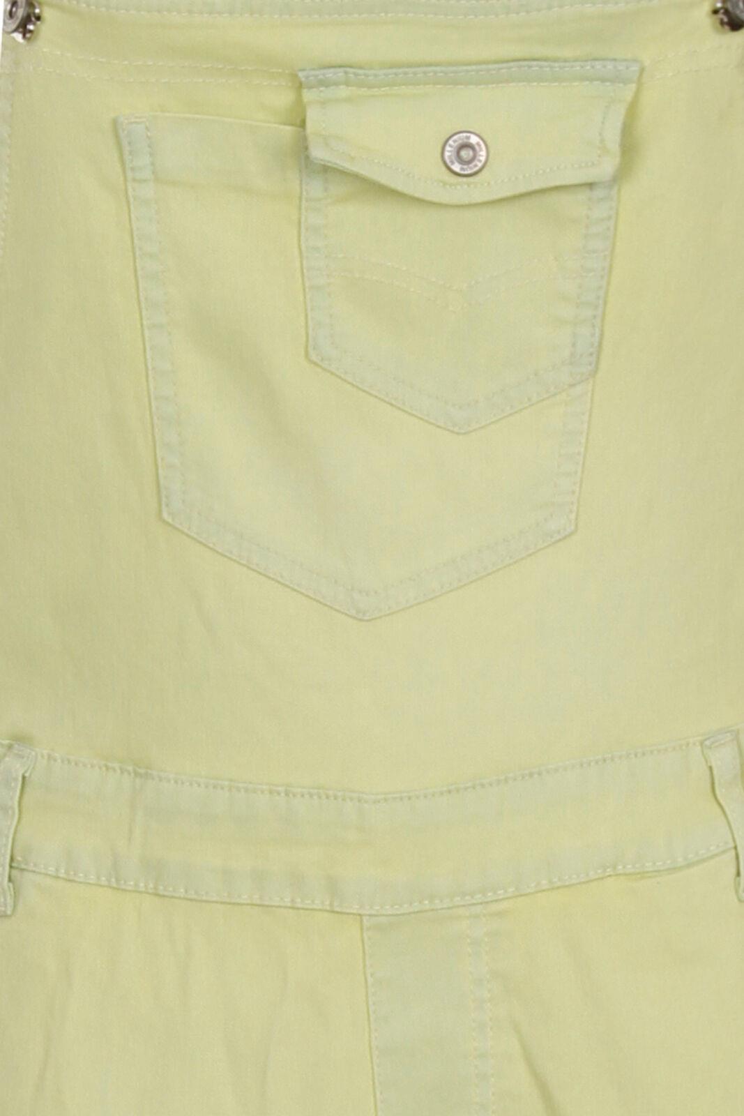 Close-up view of the bib pockets on the pale yellow skinny womens dungarees.