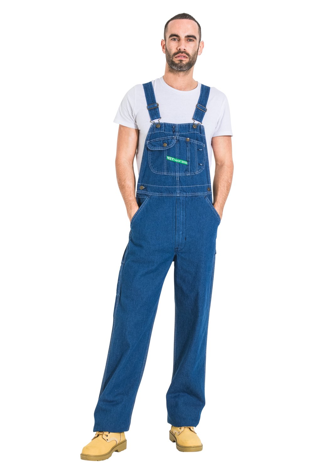 Full-length front view with hands in pockets, wearing ‘Key Apparel USA’ bib-overall made with premium materials and superior finish.
