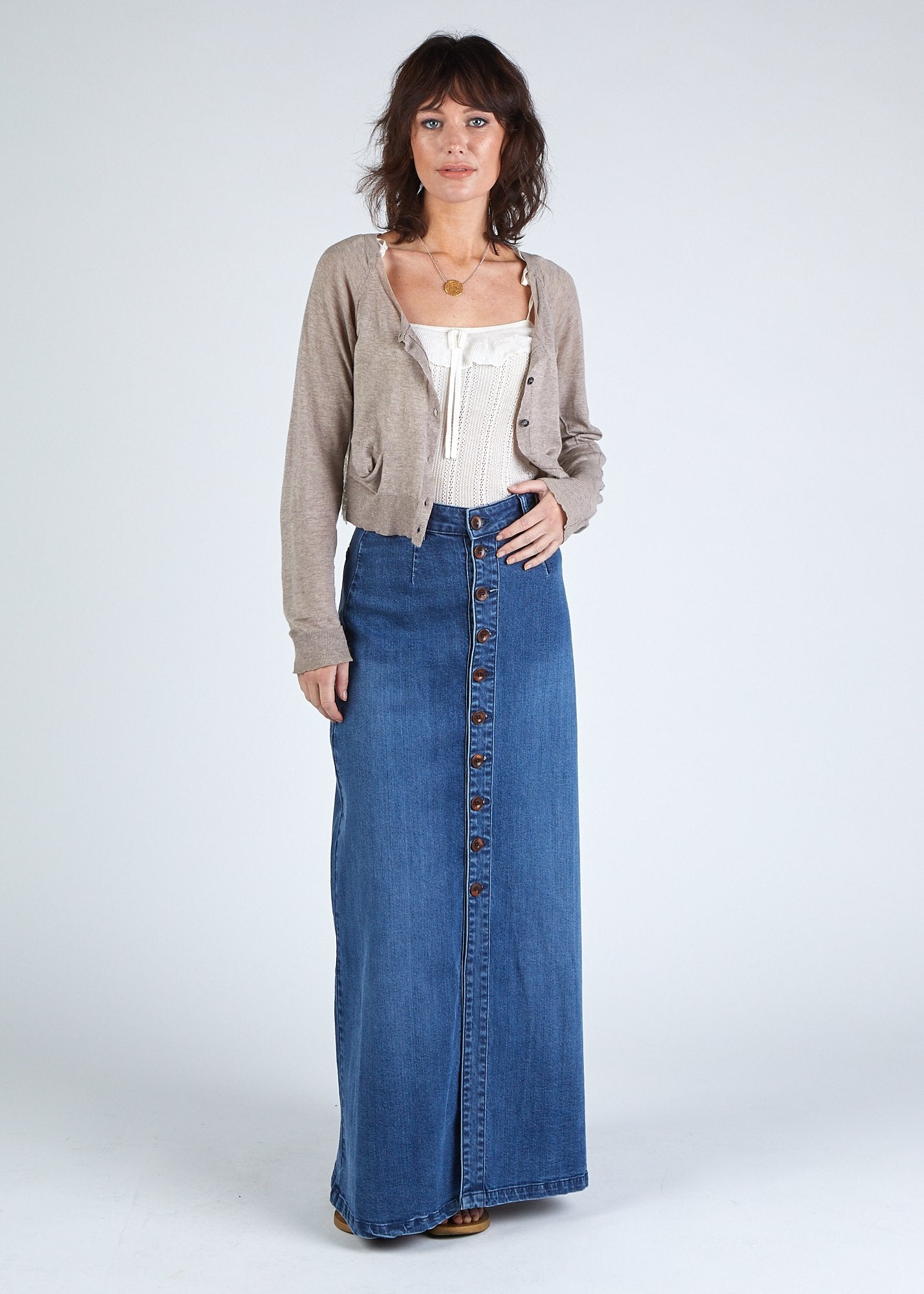 Full length front view of button-front, stretchy organic cotton, maxi denim skirt.