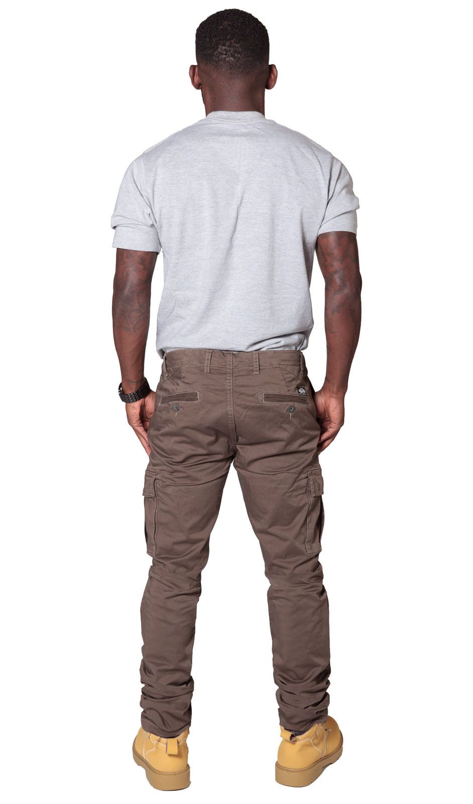 Rear view of ‘Pete’ style, casual cotton mix cargo trousers in brown with view of back pockets from Dungarees Online.