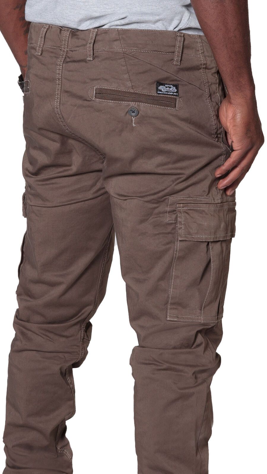 Angled rear focus of cargo trousers, with clear view of stitching, rear and cargo pockets and slightly stretchy brown material.