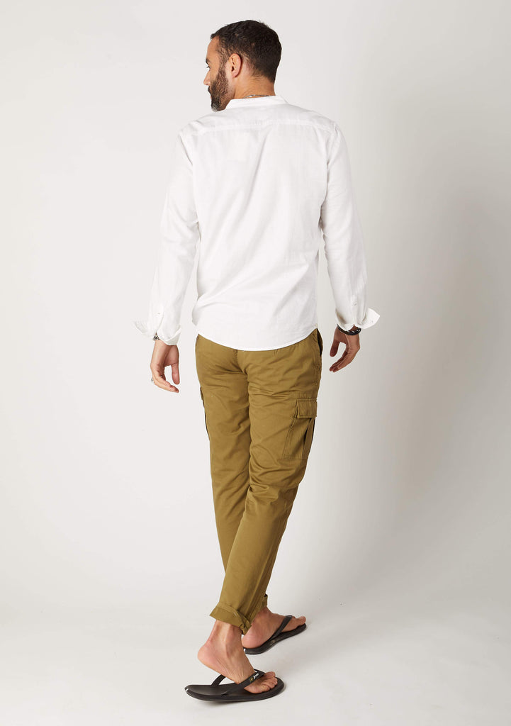 Full-length angled rear pose looking left, wearing olive cargo pants with view of cargo pockets.