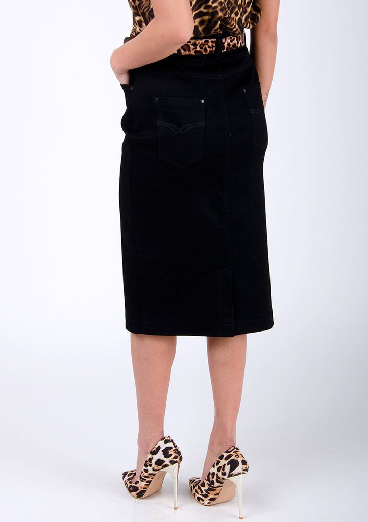 Half-rear pose focussed on back of smart, black denim midi-skirt.