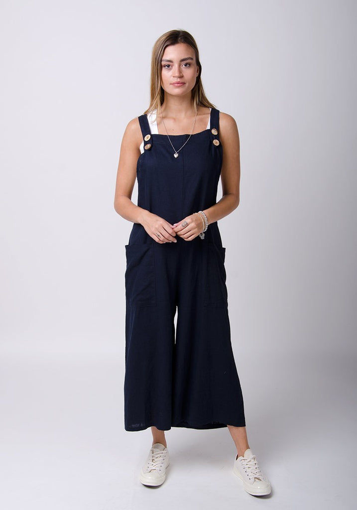 Full front pose wearing WASH Clothing Company’s navy-blue linen dungarees.