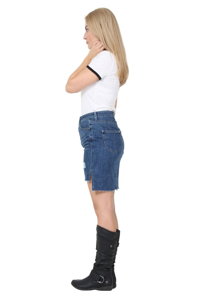 Full-length side view of ‘Chloe’ denim skirt showing belt loops and both front and rear pockets and raw hem finish.