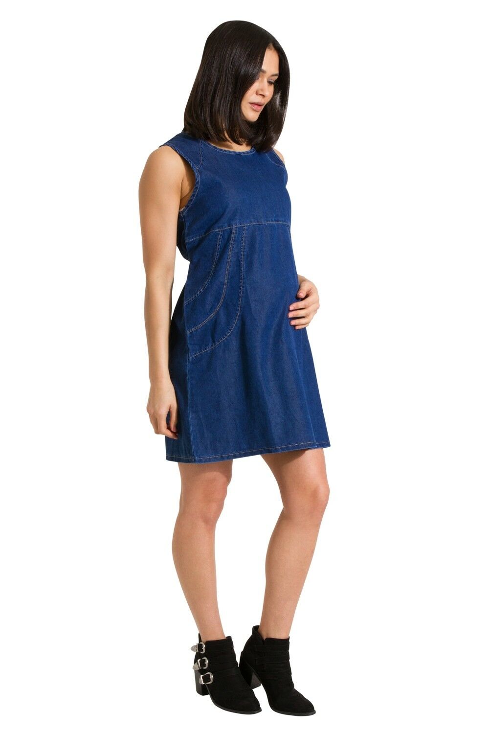 Full-length front view of Thelma soft denim blue pinafore maternity dress.
