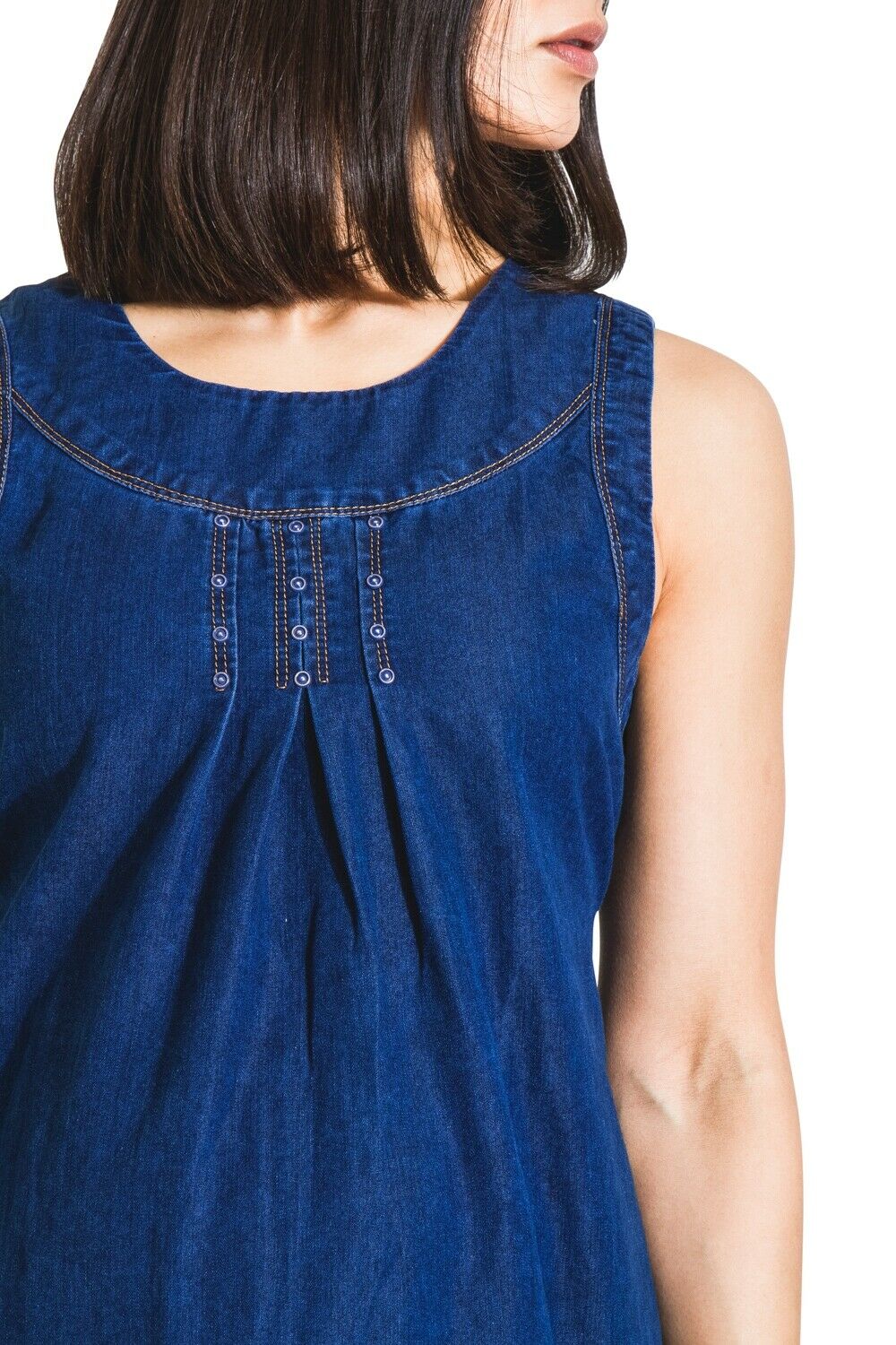 Mid view of the front of the Tina sleeveless denim maternity dress with view of neckline and decorative stitch detailing.