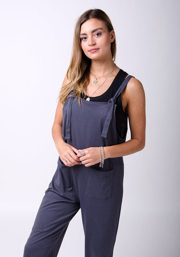 Two-thirds frontal pose wearing Mabel-style pale charcoal jersey jumpsuit.